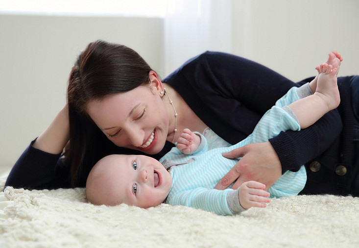 Mother and her 6 month old baby son in a sweet studio portrait taken by Minnesota photographer Kari Layland