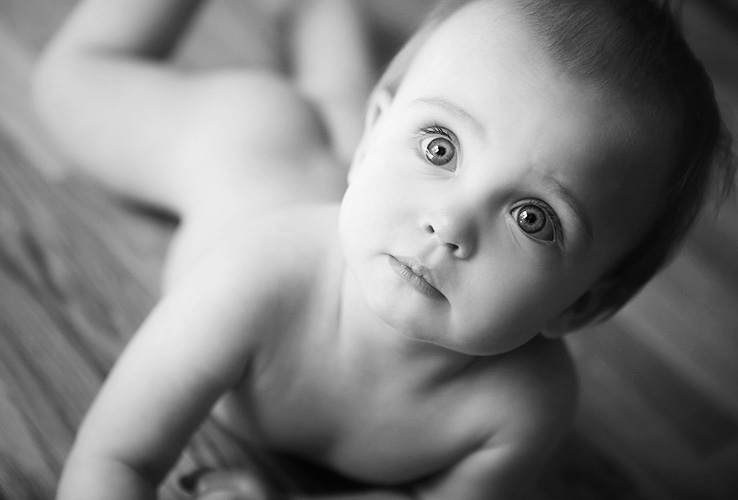 Beautiful 8 month old baby girl in a black and white portrait photographed by Kari Layland, MN portrait photographer.